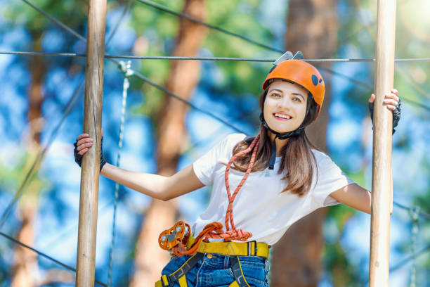 istock Woman wears protective helmet enjoy active leisure in rope park 1138142899