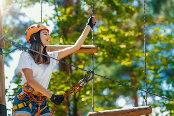 istock Woman wears protective helmet enjoy active leisure in rope park 1138142948