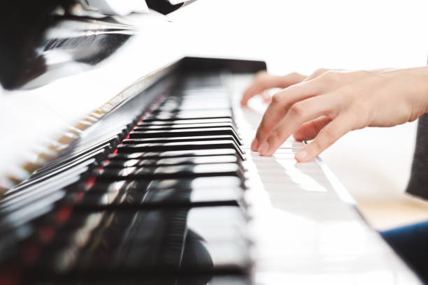 istock Classic piano key with musician hands playing 1138143557