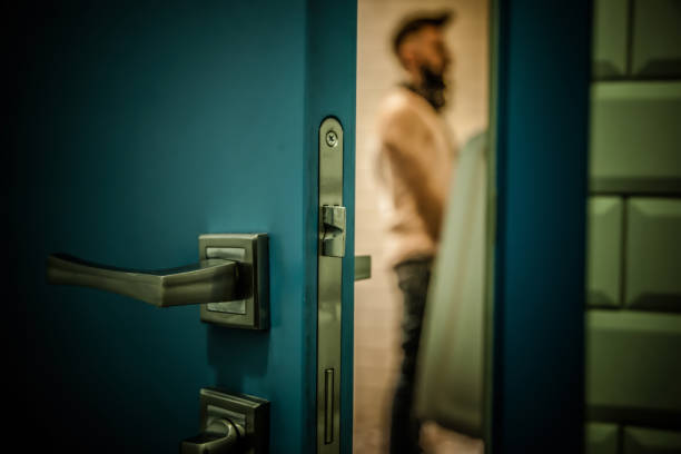 Man in a public toilet Urinal, Toilet, Bathroom, Urine, Urinating, Adult, Men public restroom photos stock pictures, royalty-free photos & images