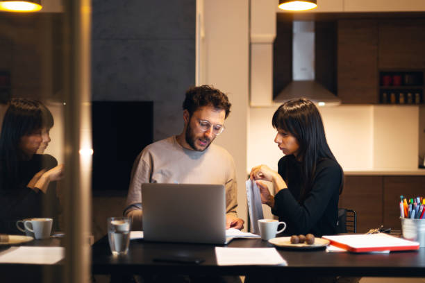 istock Couple is paying bills from home 1138145305