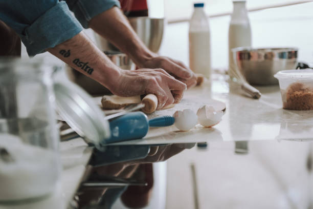 istock Person standing at the table and rolling dough 1138147647