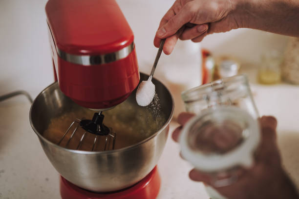 istock Hand sifting sugar into the bowl of mixer 1138147681