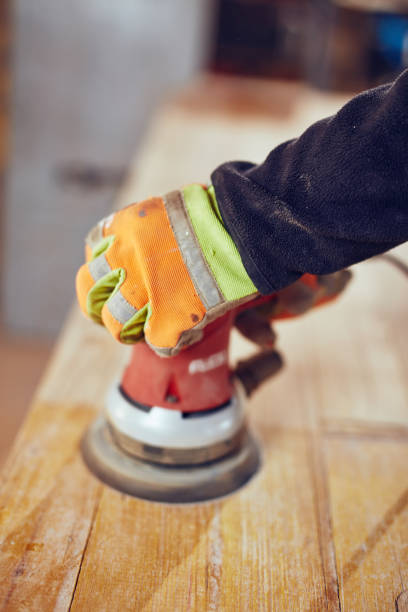 istock Male carpenter using orbital electric sander in a retro vintage workshop. 1138147906