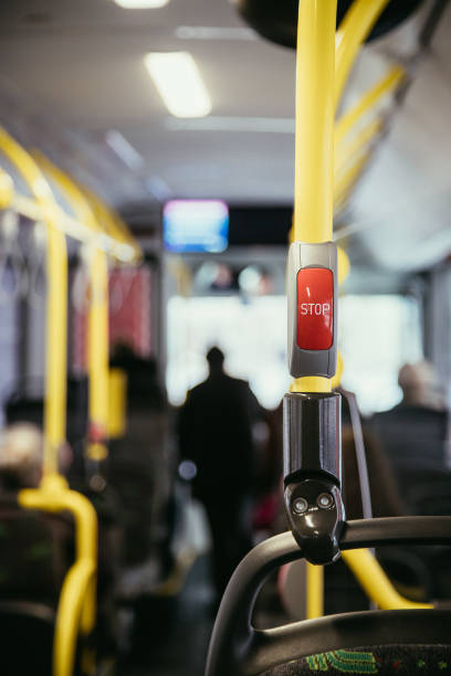 istock Interior of a public transport bus and stop Button in a bus, blurry background 1138149196