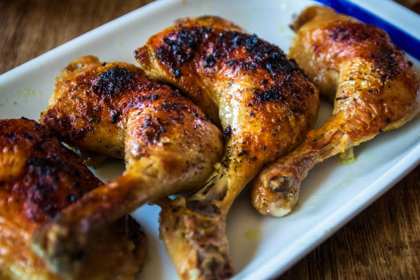istock Roasted chicken legs on wooden table 1138150832
