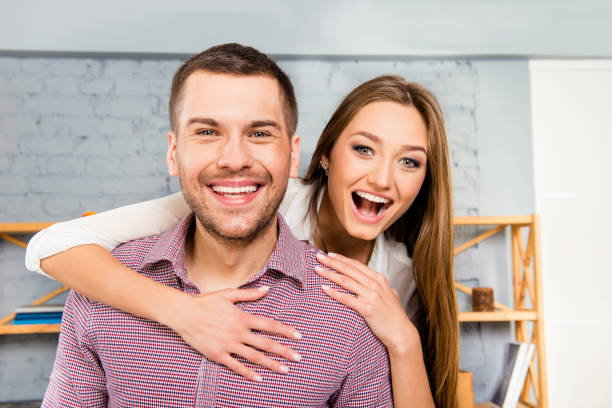 istock Cheerful young woman  hugging her handsome smiling boyfriend 1138150849