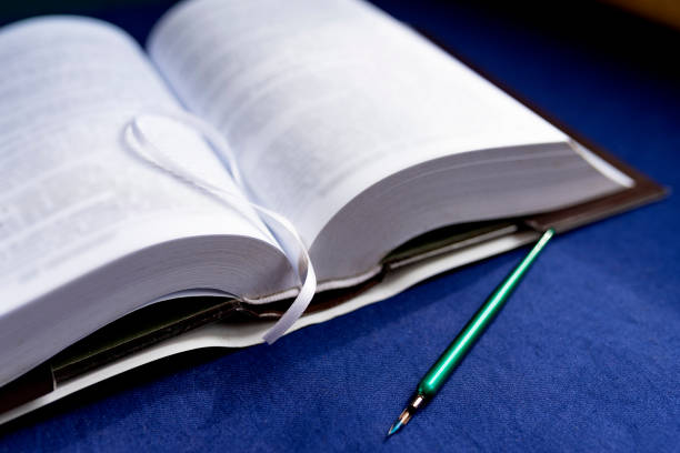 Pages of solved book and pen. Closeup, image