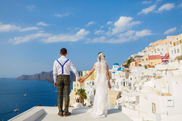 istock Beautiful wedding couple in Santorini, Greece 1138155117