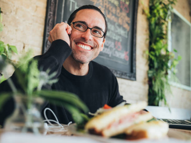 istock Caucasian man having a coffee at the small bistro 1138155273