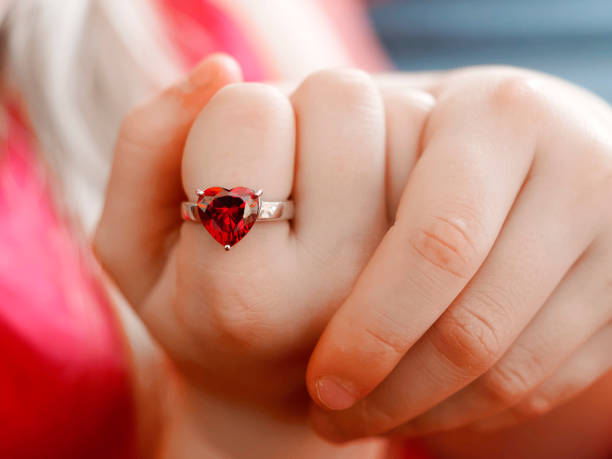 istock blond white girl with silver heart ring 1138156632
