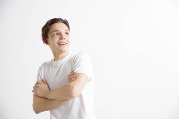istock Young dreaming teenager isolated on white background looking at something 1138156979