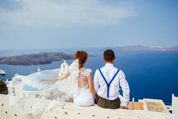 istock Bride and groom  look at the sea 1138157244
