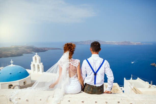 istock Bride and groom  look at the sea 1138157261