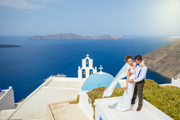 istock Bride and groom dancing on the roof 1138157379
