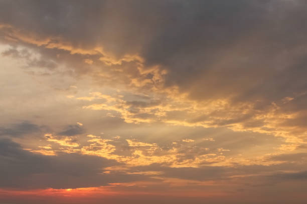 istock Dramatic sunset sky with orange colored clouds and last rays of the sun, colorful evening background 1138157381