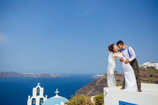 istock Bride and groom dancing on the roof 1138157413