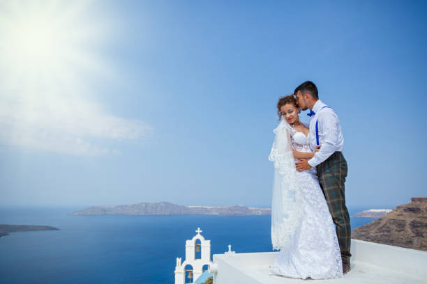istock Bride and groom dancing on the roof 1138157437