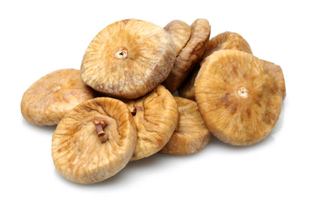 fichi secchi isolati su bianco - dried fig brown color image dried food foto e immagini stock