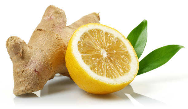 istock Fresh ginger root with leaves and lemon isolated 1138158429