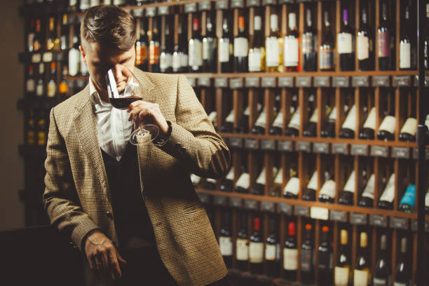 istock Male sommelier tasting red wine at cellar. 1138158565