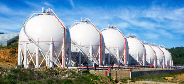 Pressurized Gas Tanks Pressurized Gas Tanks in a row storage tank photos stock pictures, royalty-free photos & images
