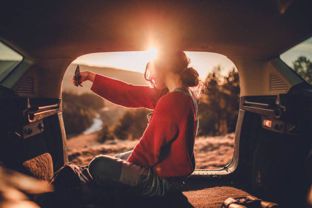 istock Woman enjoying sunset in nature 1138158664