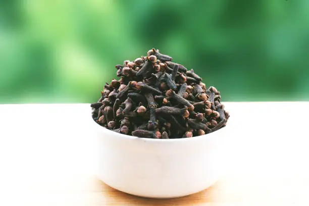 Clove kept in a Bowl with background-Image