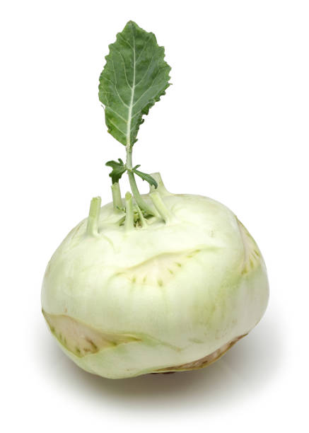 istock Single white kohlrabi with leaf isolated on white 1138159141