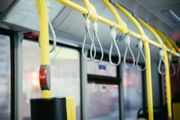 istock Interior of a public transport bus and stop Button in a bus, blurry background 1138161614