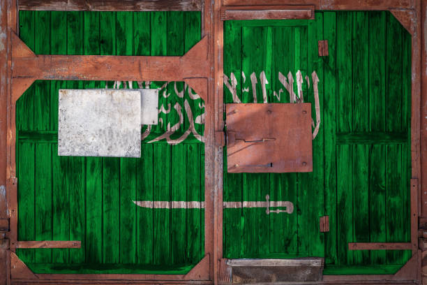 istock Close-up of old warehouse gate with national flag 1138165328