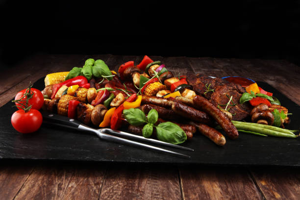 istock Assorted delicious grilled meat and skewer with vegetable on rustic table 1138167486