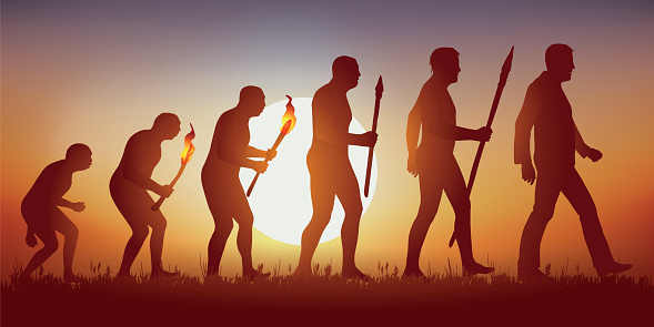 Concept of Darwin's theory of evolution, illustrated with the transformation of the human silhouette from primitive man to modern man.