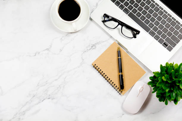 istock Workspace in office , Marble White desk with blank notebook and other office supplies,Top view with copy space. 1138169268
