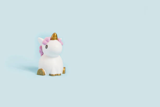 istock white toy unicorn and ladybug on a blue background 1138169780