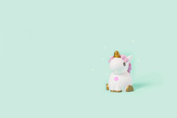 istock white toy unicorn and ladybug on a blue background 1138169781