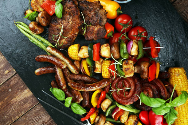 istock Assorted delicious grilled meat and skewer with vegetable on rustic table 1138170414
