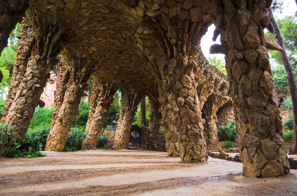 View of arcade in Tunnel Rock Trail of Antonio Gaudi inside Park Guell, Barcelona, Spain
