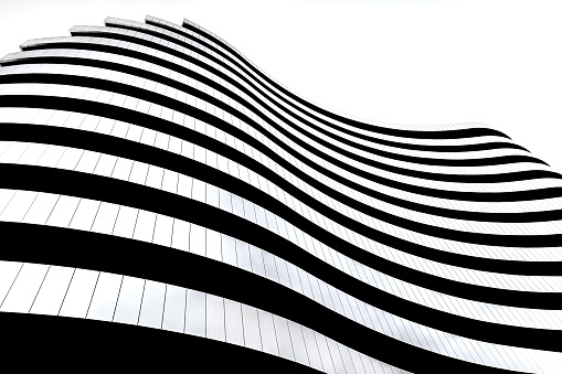 Modern architecture in Serbia. Waves facade design. Building in the shape of a flag.