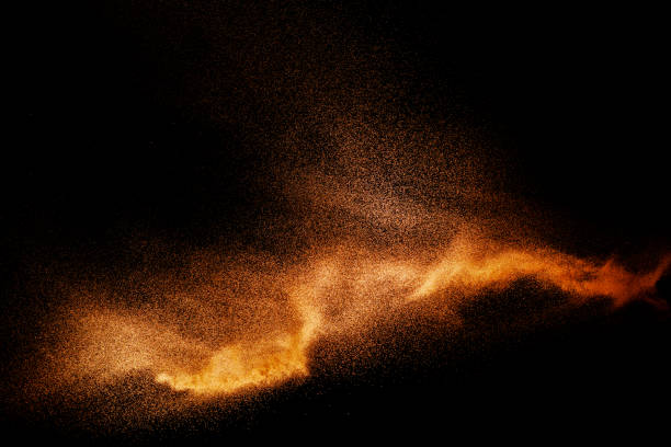 istock Golden sand explosion isolated on black background. Abstract sand cloud. 1138172119