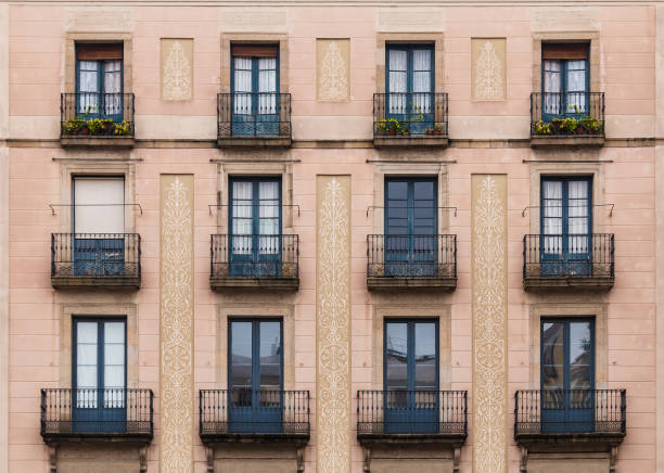 istock Windows and balconies in row on facade of historic building 1138172849