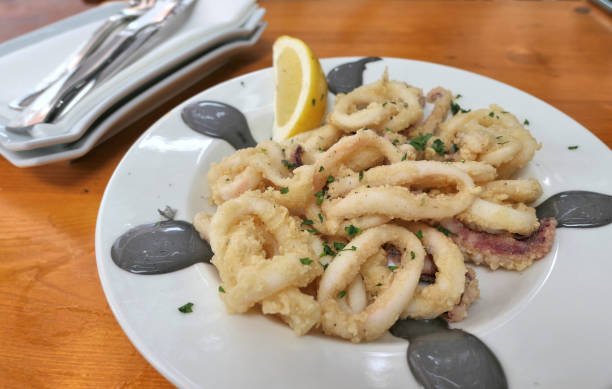 istock Fried breaded calamari dish in a restaurant of Menorca. 1138173092