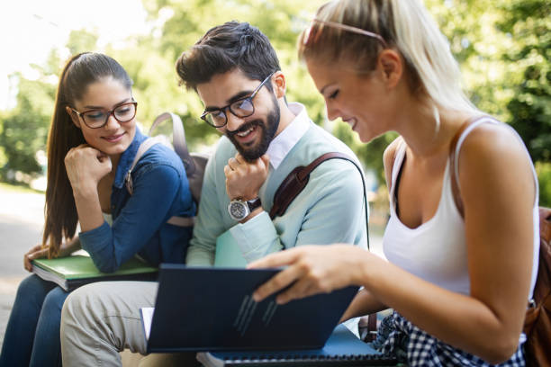 istock Group of friends studying together at university campus 1138174788