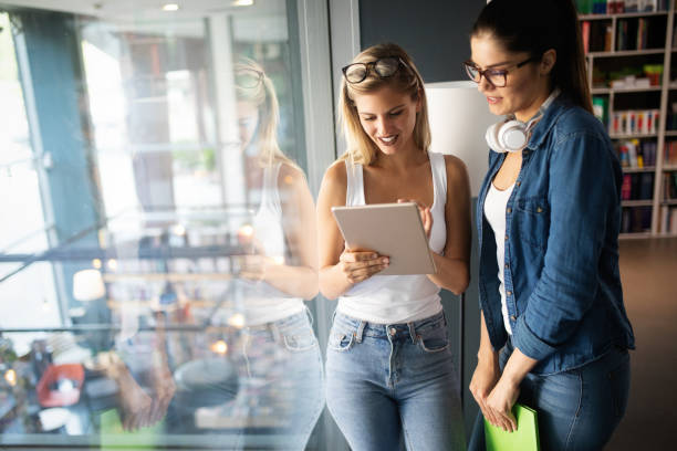istock Group of young students are studying together in university 1138174834