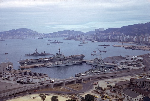 Hong Kong, China, 1966. British aircraft carrier with escort ships in front of Hong Kong.
