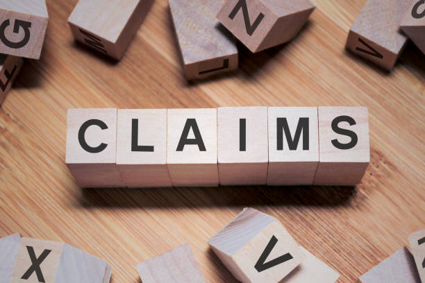 istock CLAIMS Word In Wooden Cube 1138177304