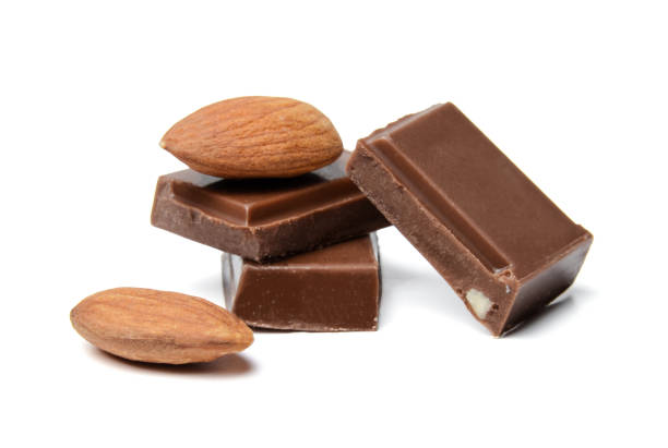 istock A composition of small chocolate bars and almond nuts. White isolated background. Close-up. Side view. 1138177808