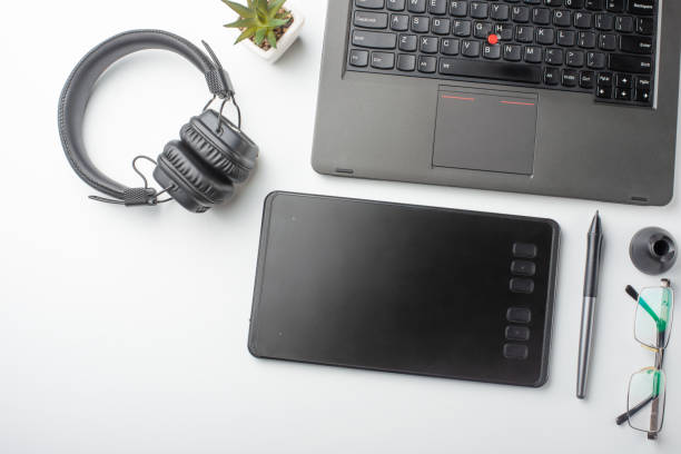 istock Desktop designer and creative retoucher with a graphics tablet, laptop, glasses. Design, flat lay 1138181261
