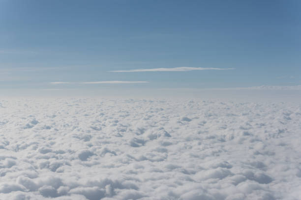 istock cloud and sky view from the window of an airplane 1138182584