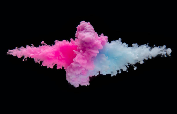 istock Coloured acrylic ink mixing in water on black 1138183199